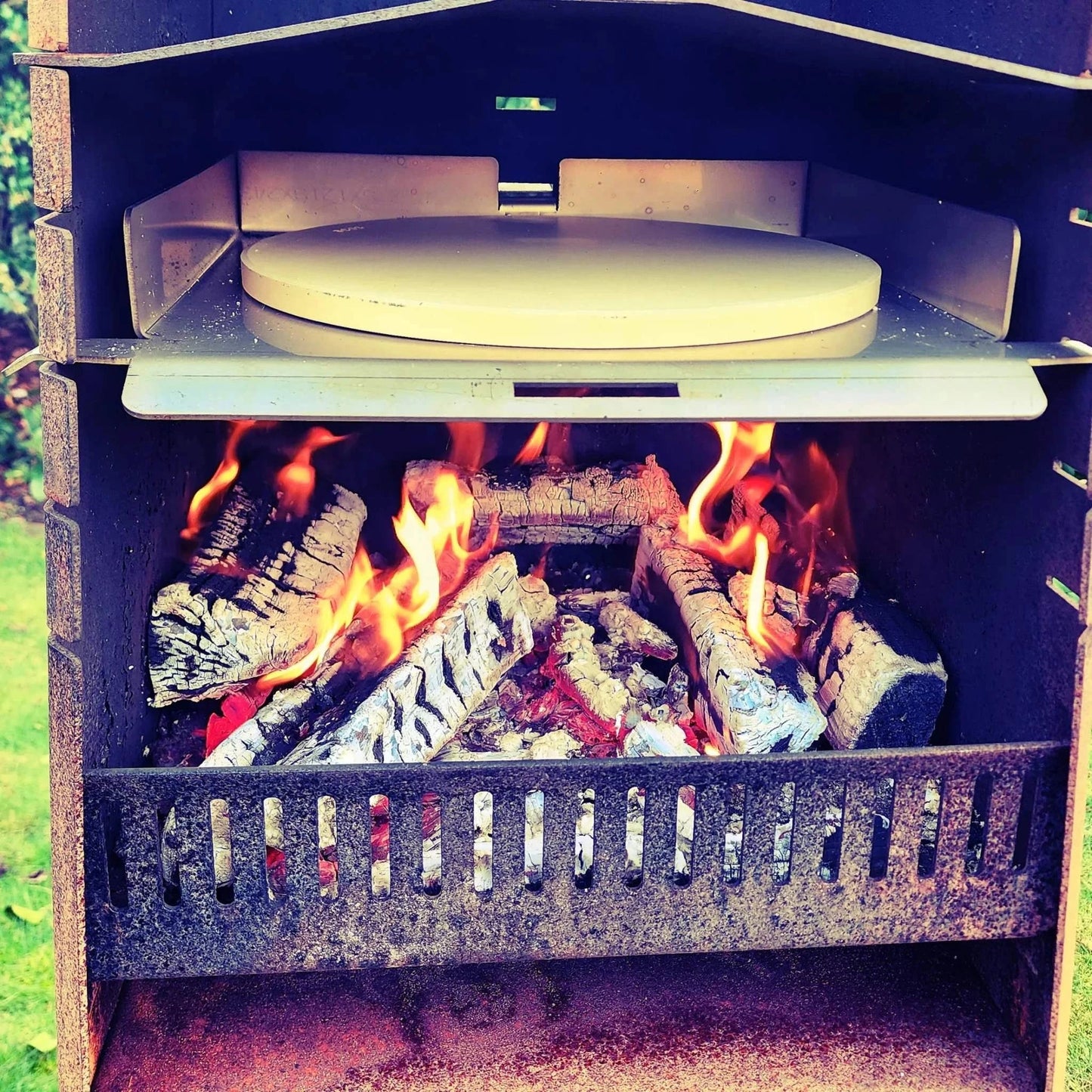 Pizza kit for Obelisk outdoor fire with pizza stone and peel.