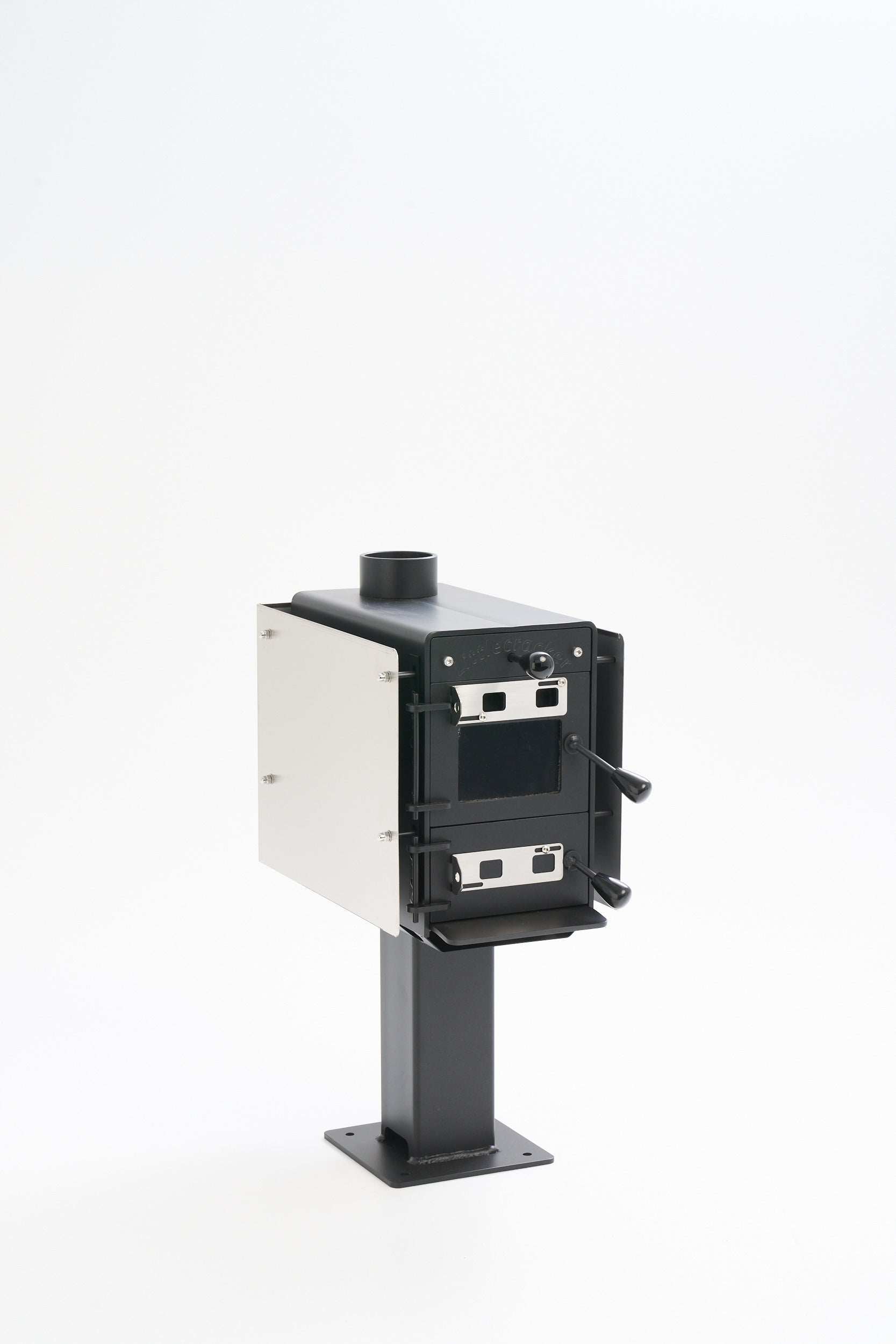 Little Cracker multi-fuel fire with flue system for motorhome installation.