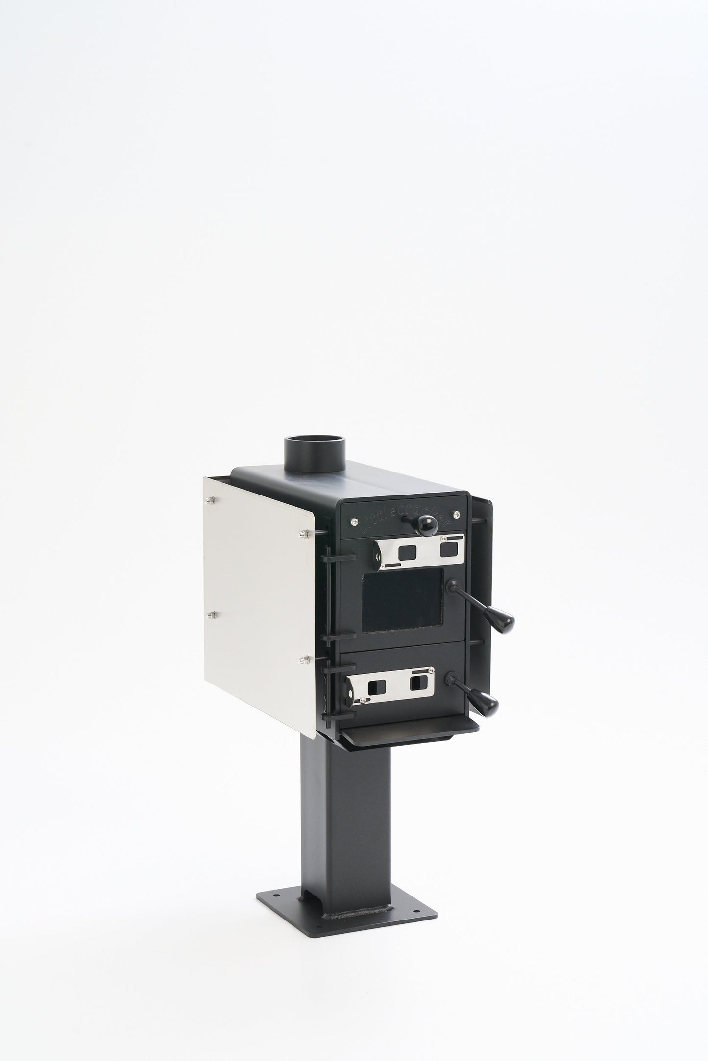 Little Cracker multi-fuel fire with flue system for dwellings, compact solid fuel heater.