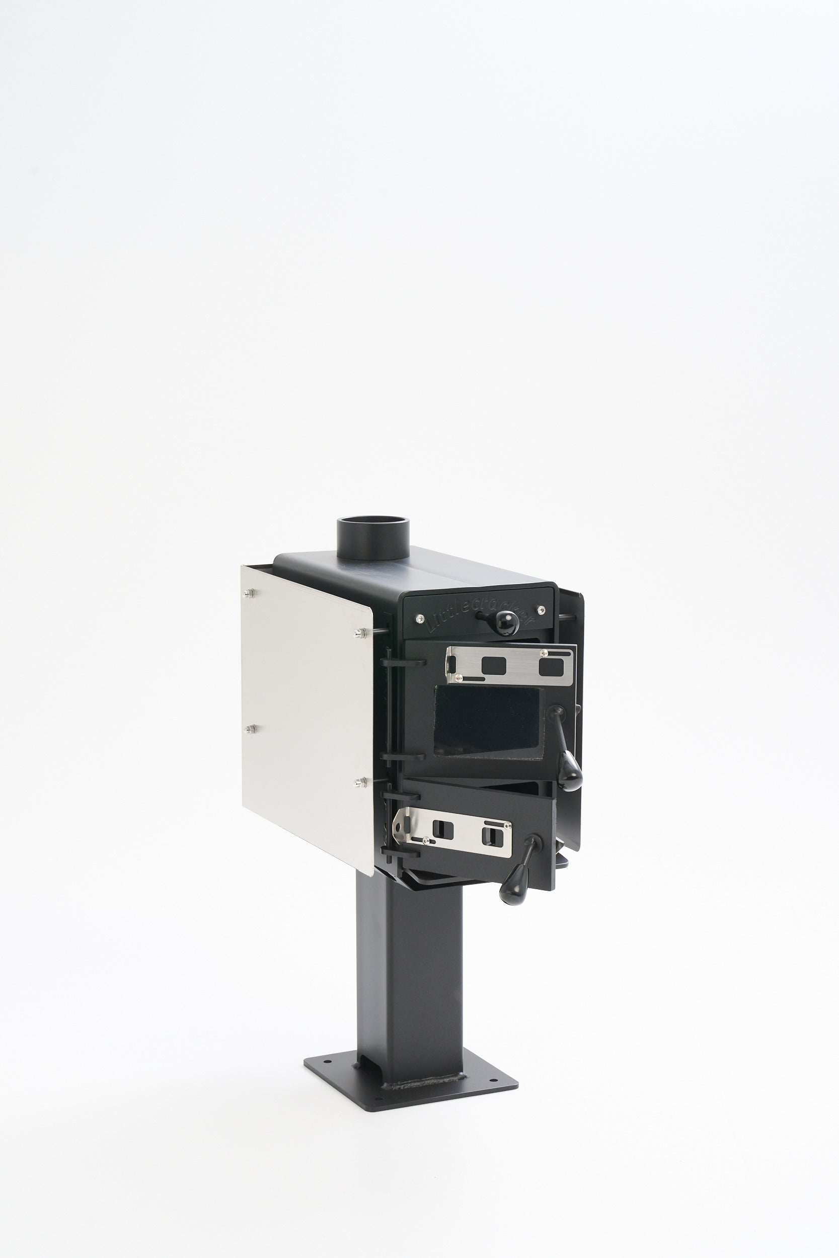 Compact Little Cracker multi-fuel heater with 2M flue system for motorhomes.