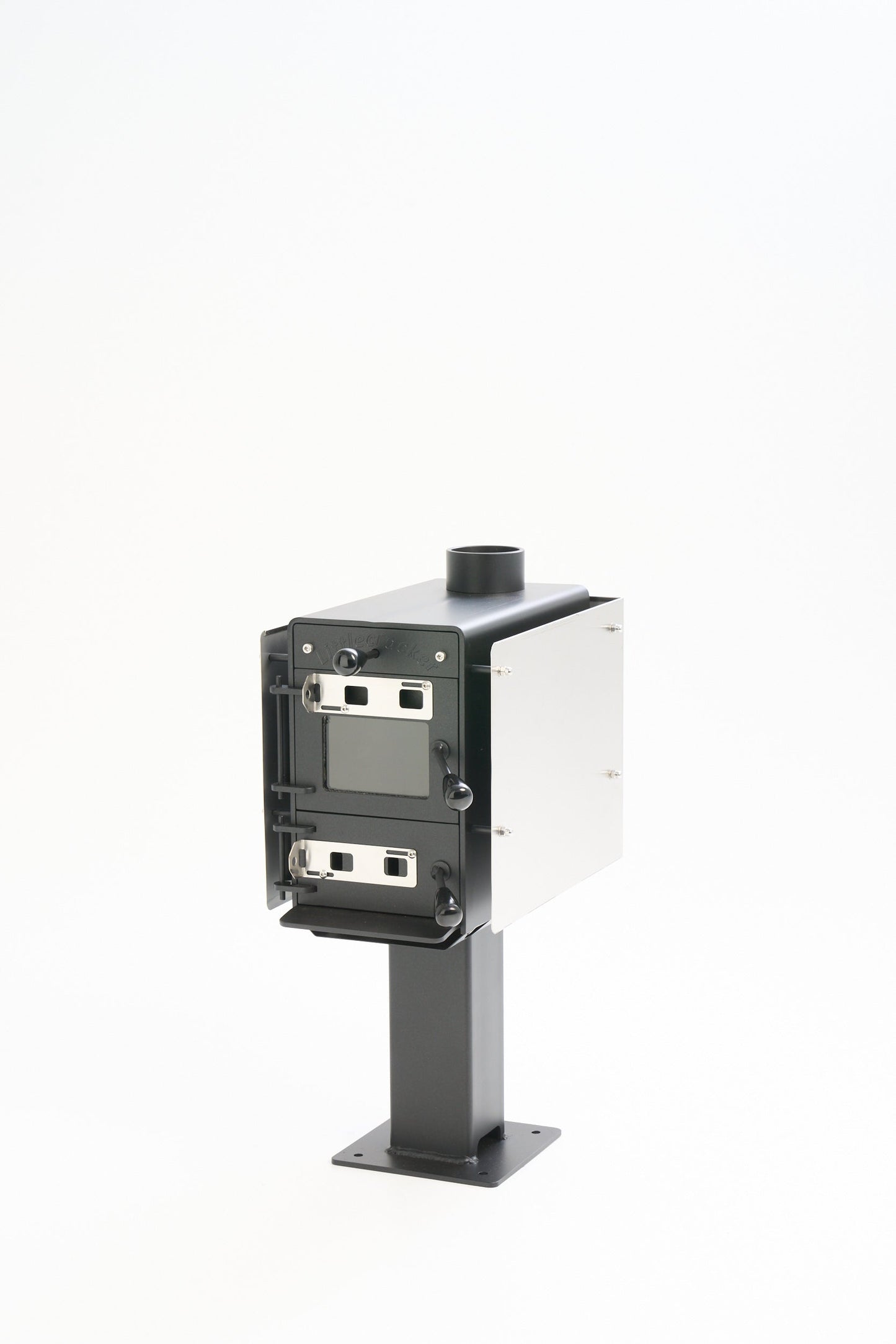 Compact Little Cracker multi-fuel fire with 4M flue system, ideal for small spaces, featuring durable 6mm steel construction.