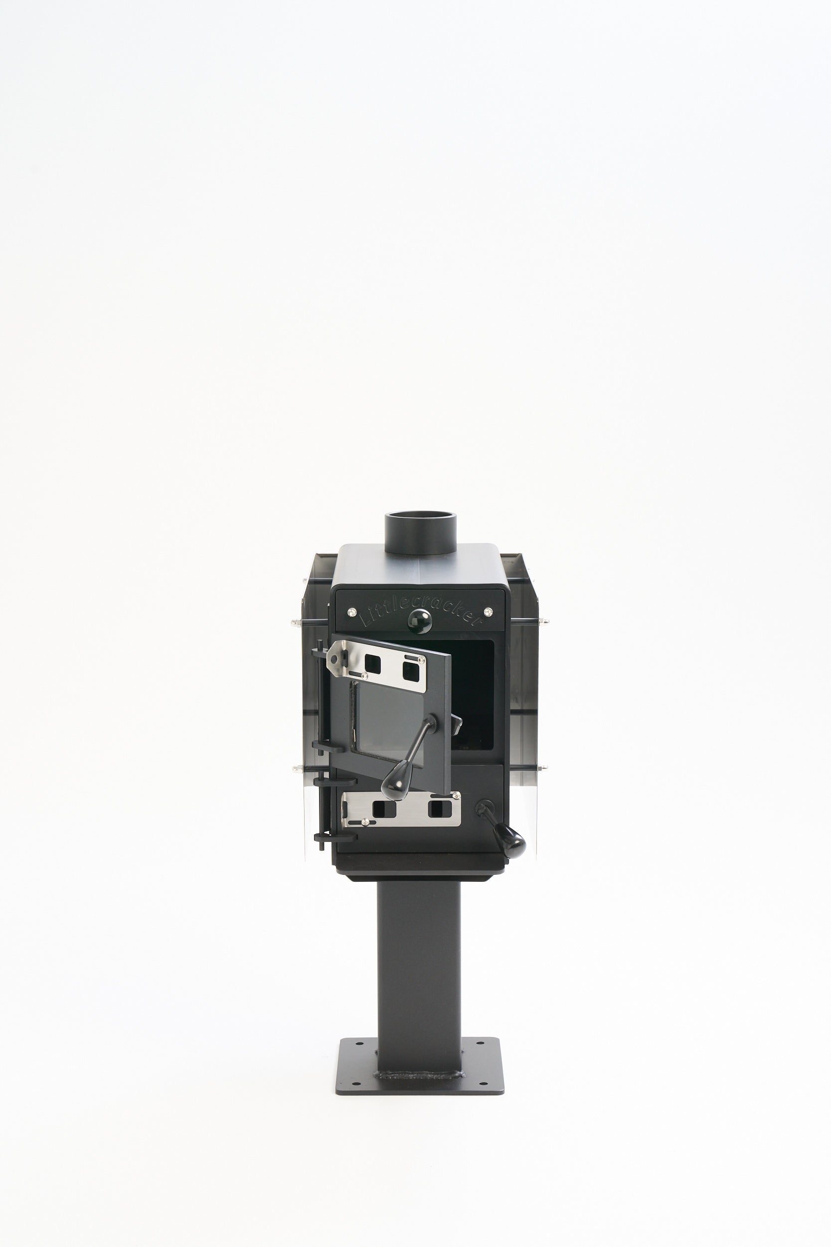 Little Cracker multi-fuel fire with open door for motorhome including 2m flue system.