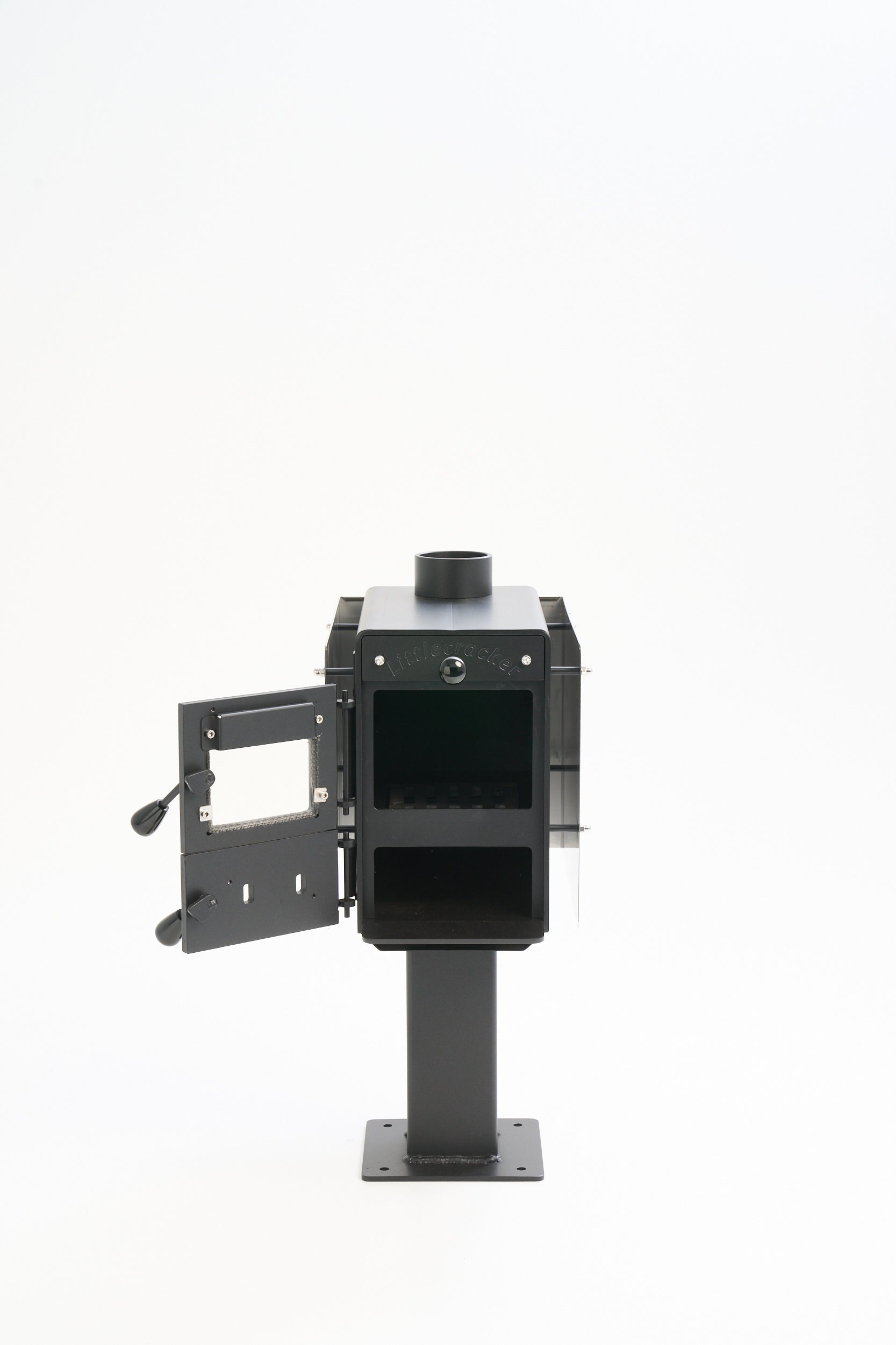 Little Cracker multi-fuel fire with open door and 2m flue system for motorhomes.