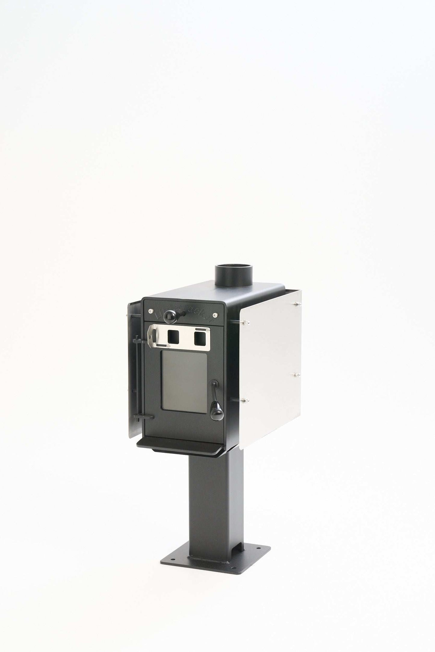 Compact wood burning heater, Little Cracker Woody with 4m flue system, ideal for tiny homes and campers.