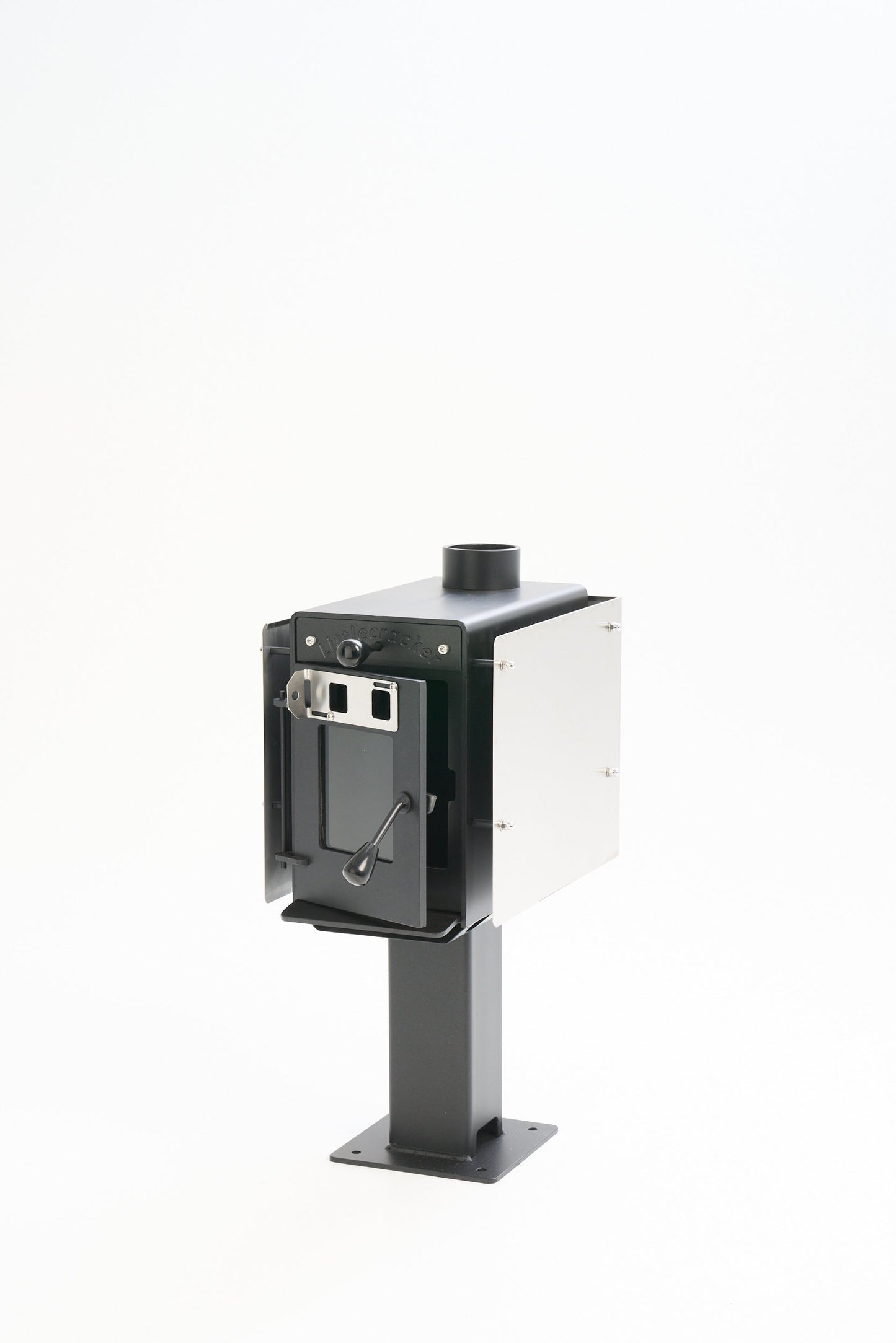 Little Cracker Woody solid fuel heater with flue system for motorhome installation.