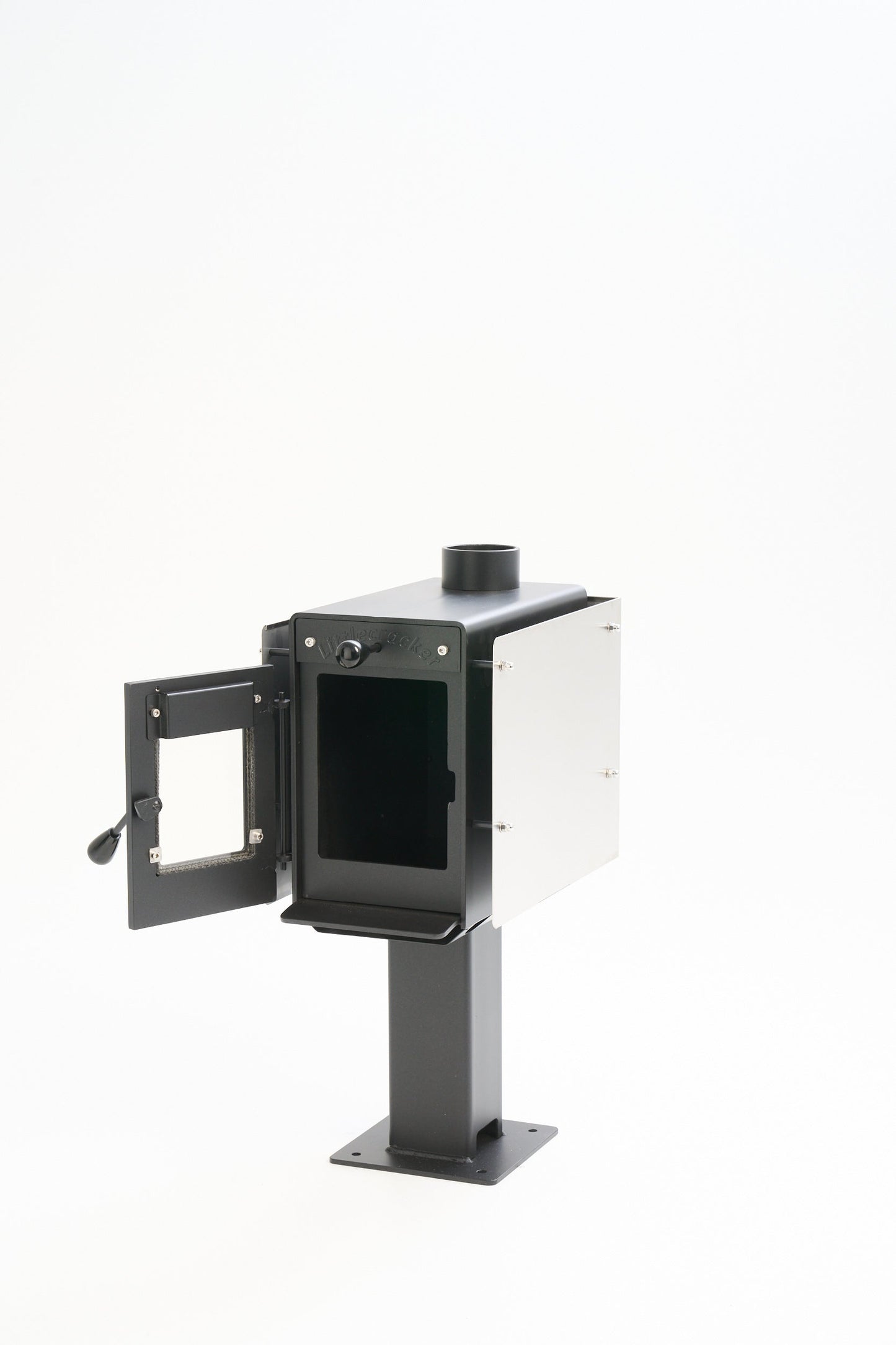 compact wood burning heater with open door and flue system for motorhome installation