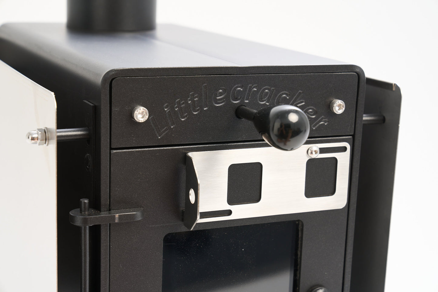 Little Cracker Woody stove with adjustable flue system for motorhomes.