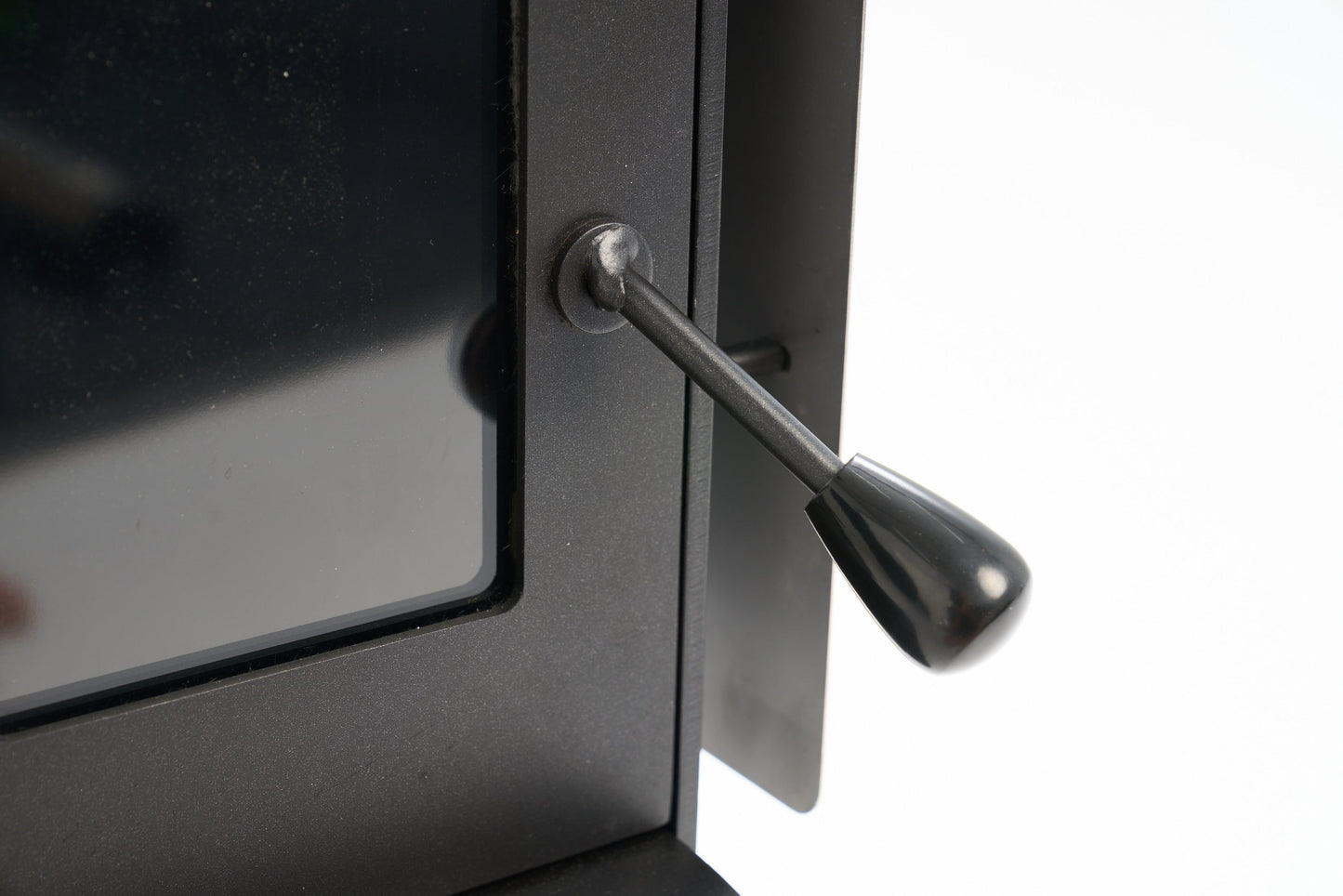 Close-up of Little Cracker Woody wood burner handle for motorhome installation.