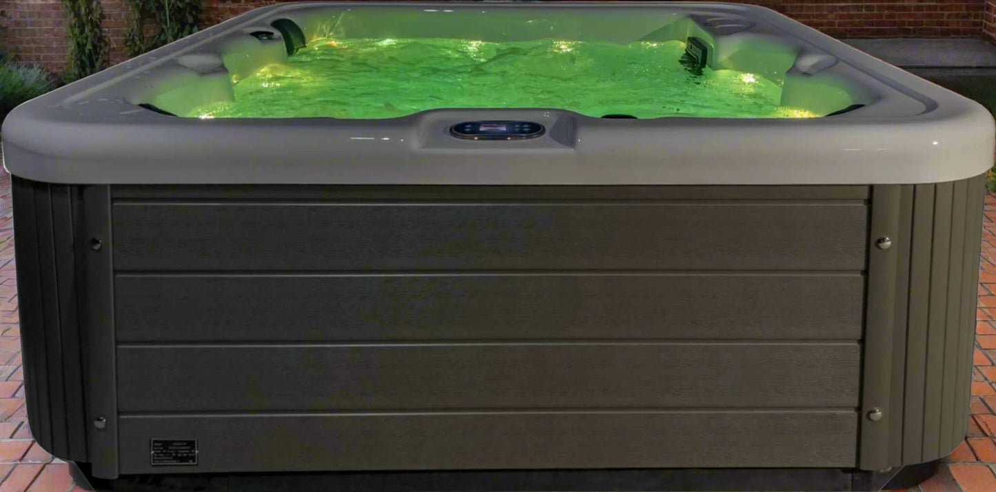 Sensation Bliss 1 Spa Pool with green LED lights and modern design.