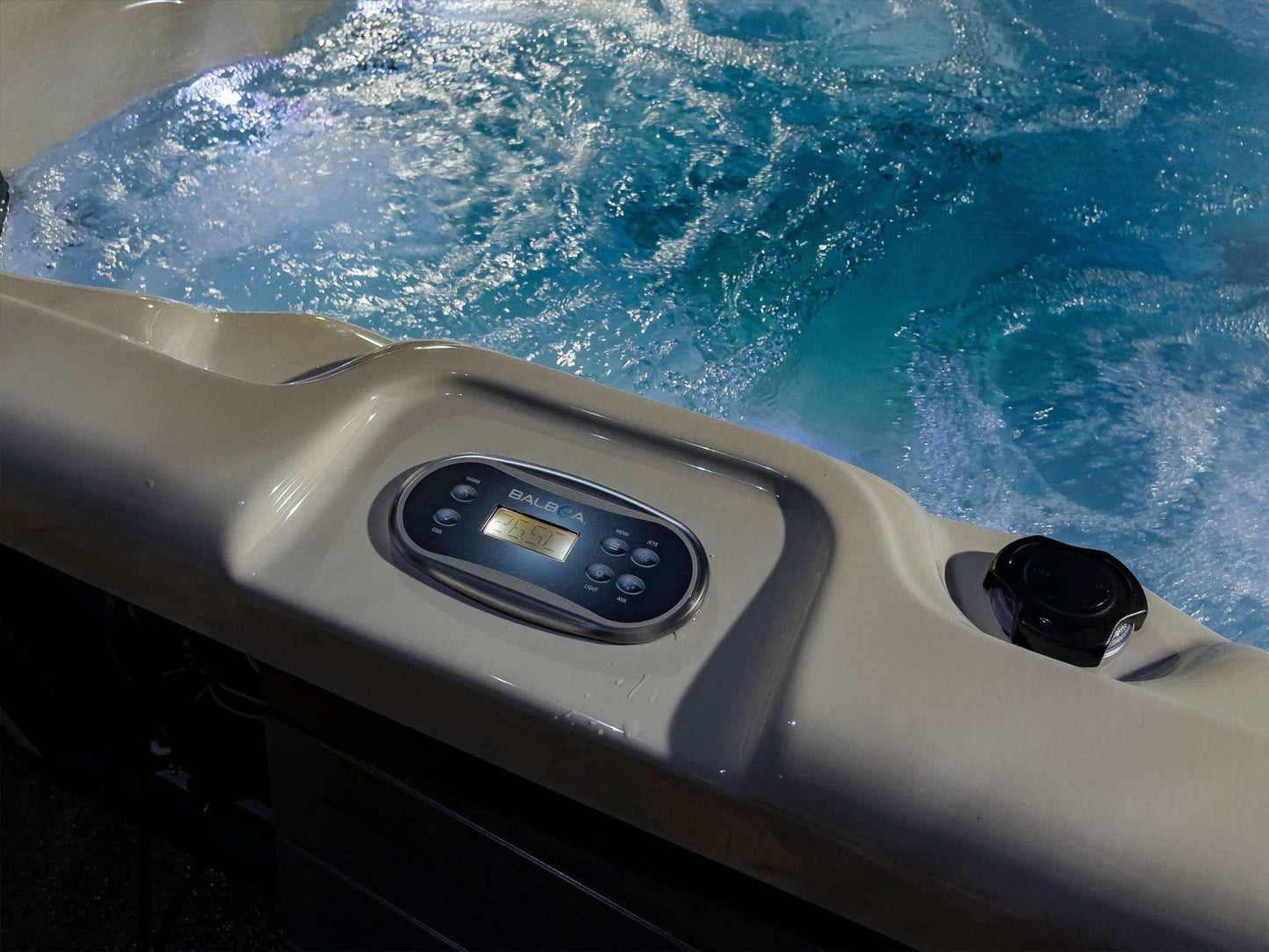Sensation Bliss 3 All Seater Spa Pool with control panel and bubbling water.