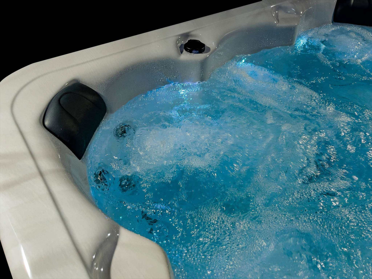 Sensation Bliss 3 All Seater Spa Pool with illuminated water and jets.