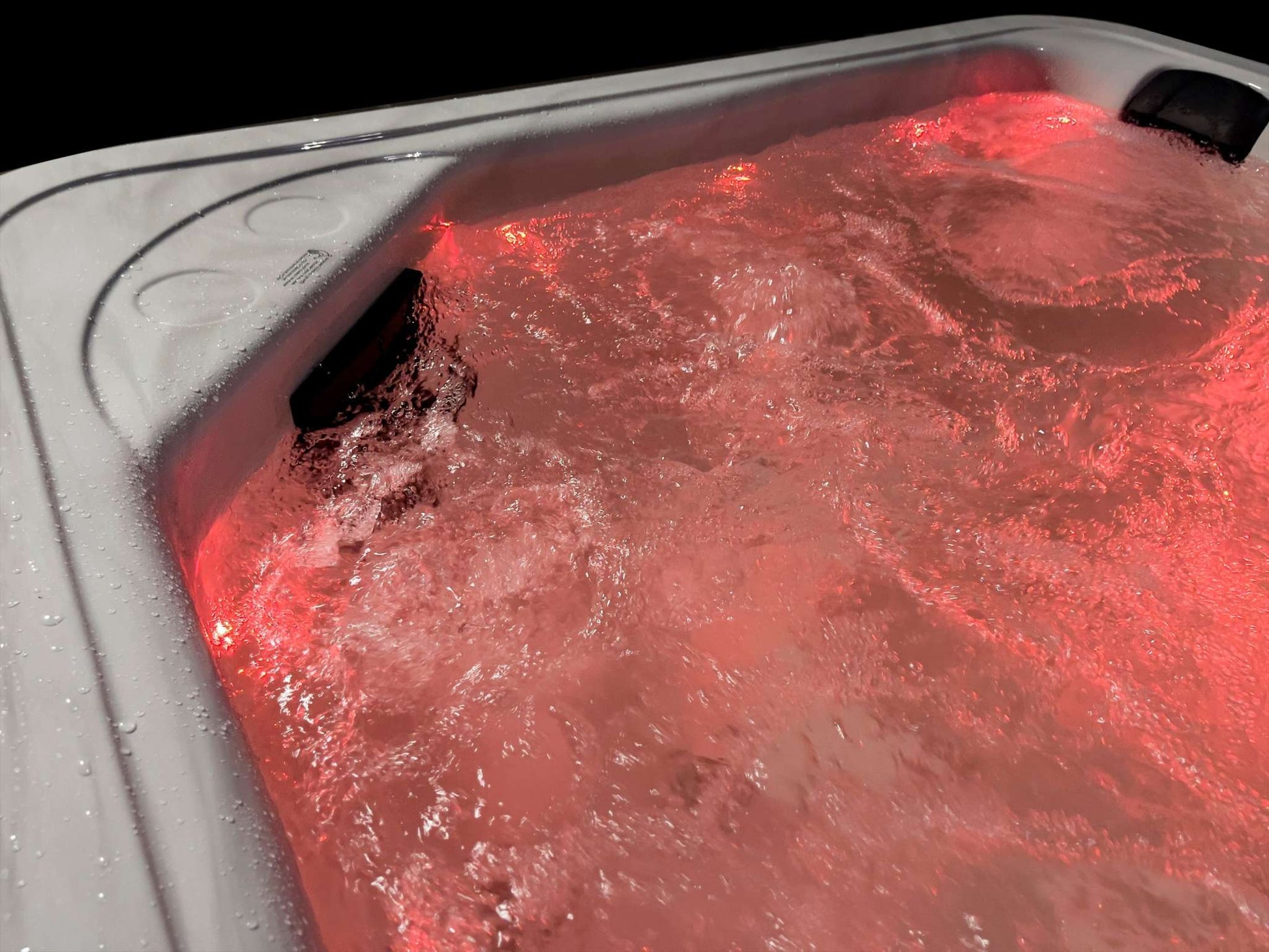 Sensation Bliss 2 Spa Pool with red LED lighting and powerful jets.