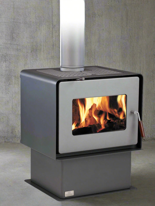 Woodsman Flare indoor fireplace with pedestal base and 4.2m pewter flue system.