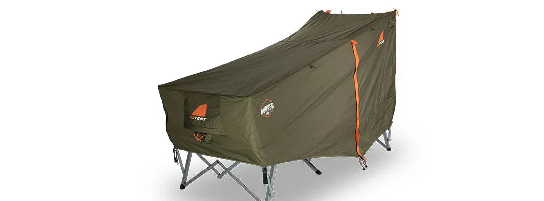 Oztent Bunker Pro Stretcher Bed with green waterproof canvas and sturdy frame.