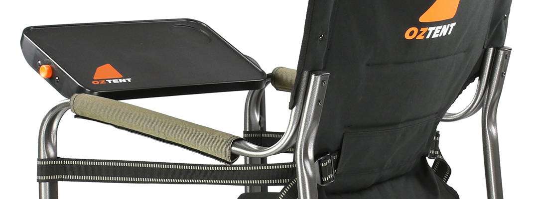 Oztent Gecko chair with side table showing adjustable table and solid armrests.
