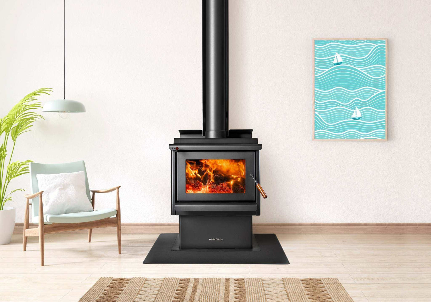 Woodsman Coleridge Pedestal Base indoor fireplace with 4.2m Heatsaver Flue System in modern living room setting.