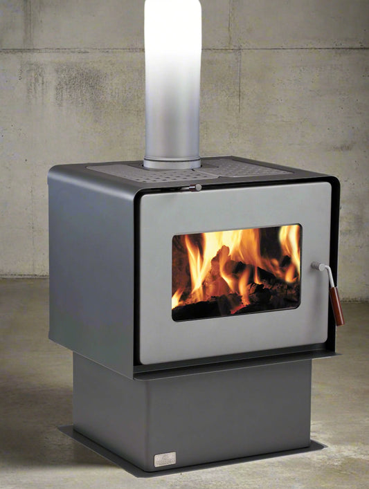 Woodsman Flare Pedestal Fire with Heatsaver Flue System in charcoal finish, ideal for medium-sized homes.
