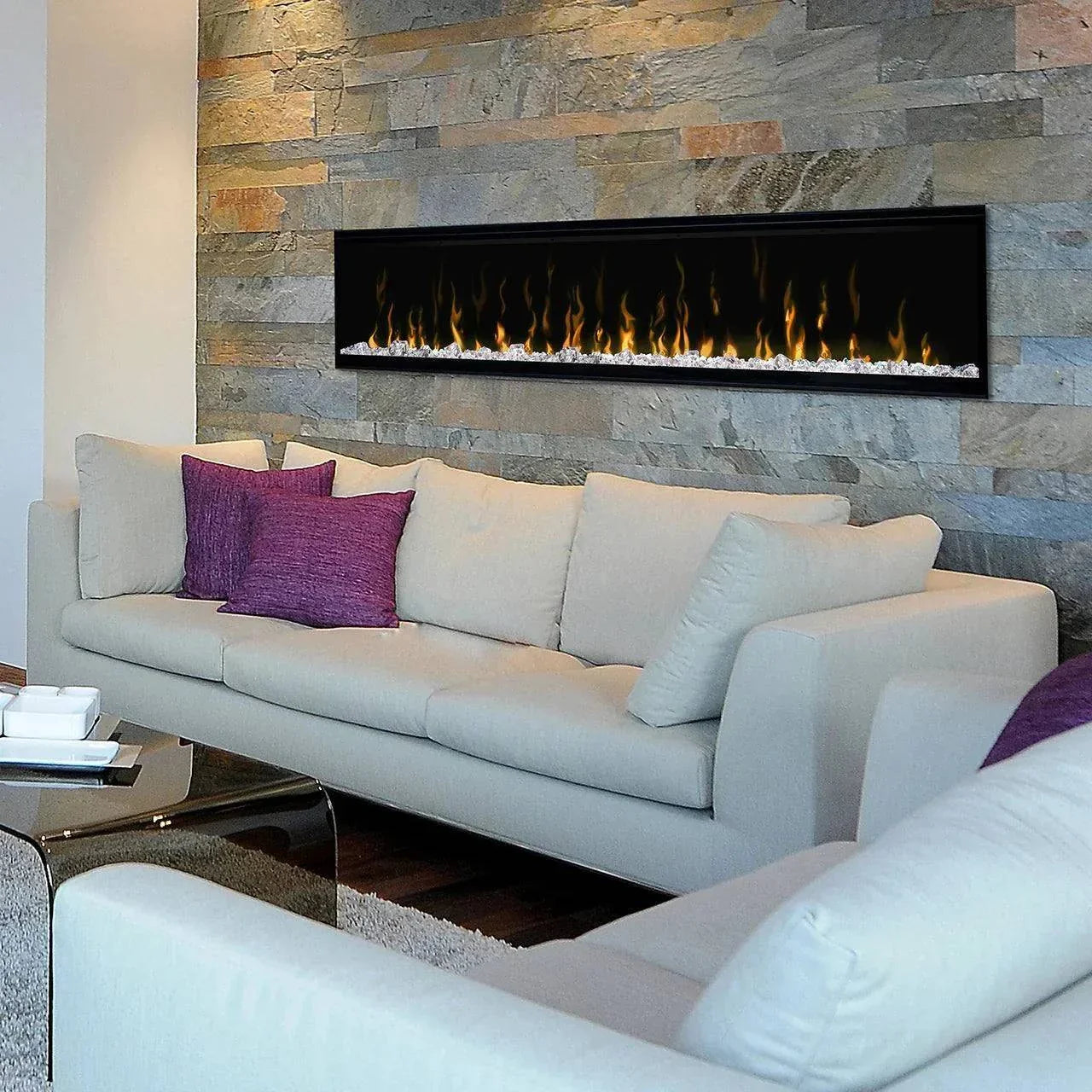 Real Flame Ignite XLF100 Linear Electric Fireplace in a modern living room setting with stone wall backdrop.