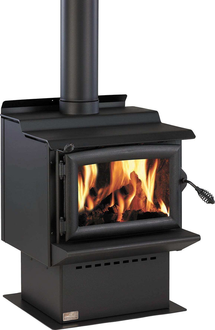 Woodsman Tasman MKII freestanding wood burner with 4.2m Heatsaver flue, black pedestal design, glowing fire inside.