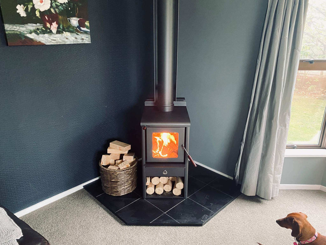 Serene Petite fireplace with 4.2m Heatsaver Flue System in a cozy room setting.