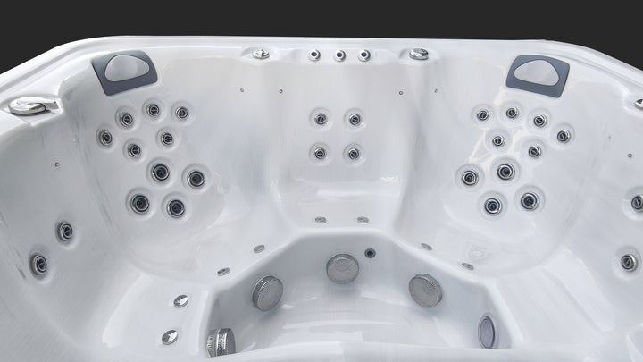 Interior view of Sensation Euphoria 5.9m Pro Swim Spa with multiple hydrotherapy jets and ergonomic seating.