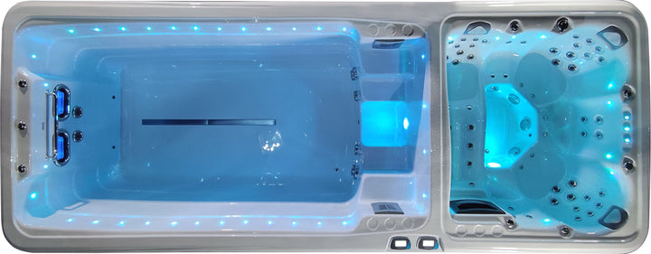 Sensation Euphoria 5.9m Pro Swim Spa with LED lights and hydrotherapy jets in a backyard setting.