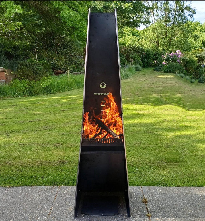 Woodsman Obelisk Outdoor Fire and BBQ in garden setting.