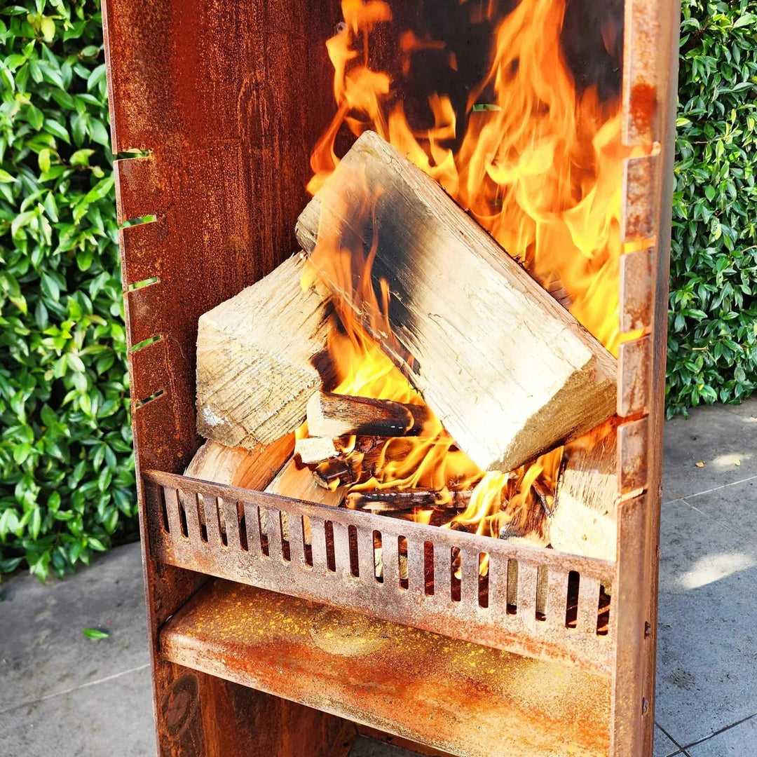 Obelisk outdoor fire with wood burning, designed for use with pizza kit.