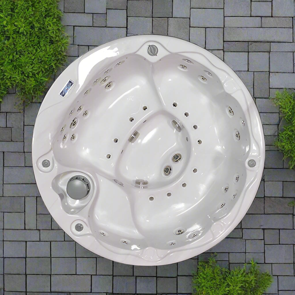 Round Sensation Lagoon hot tub with multiple jets and ergonomic seating for a luxurious spa experience.
