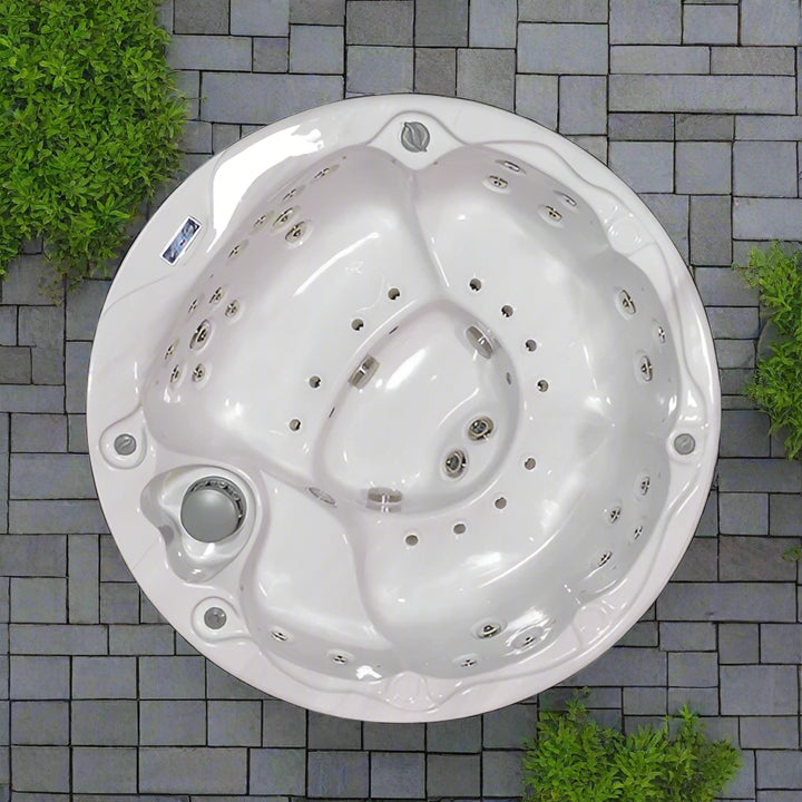 Round Sensation Lagoon hot tub with multiple jets and ergonomic seating for a luxurious spa experience.
