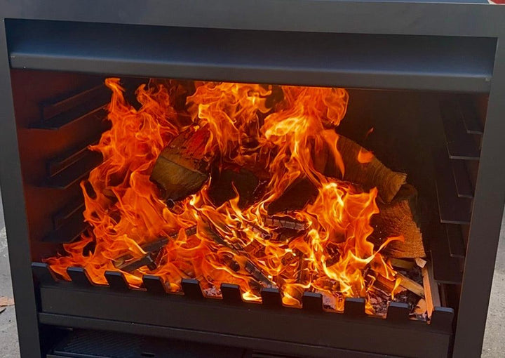 Onflame 900 outdoor fireplace with flames burning inside.