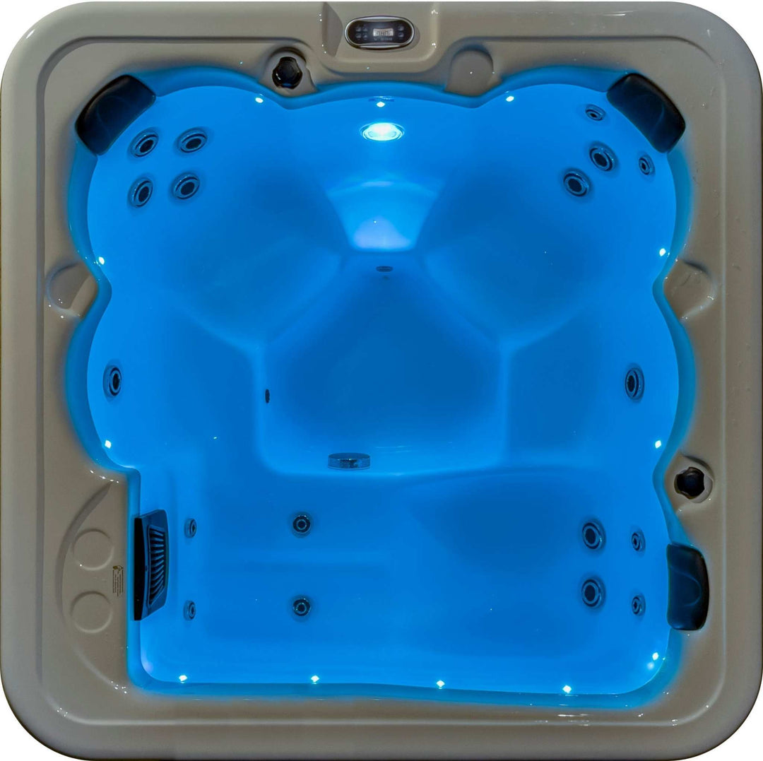 Sensation Bliss 1 Spa Pool with blue LED lighting and multiple jets, offering relaxation and rejuvenation.