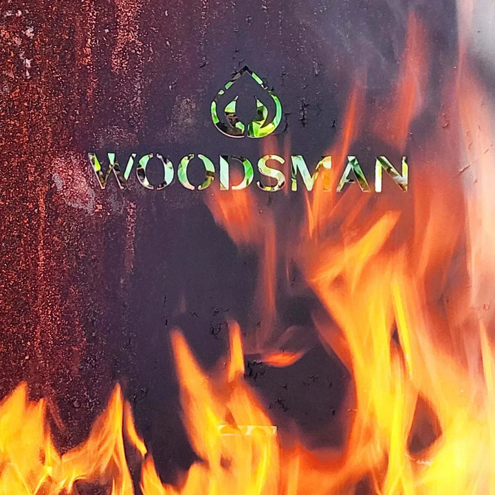 Woodsman Obelisk Outdoor Fire and BBQ with flames.