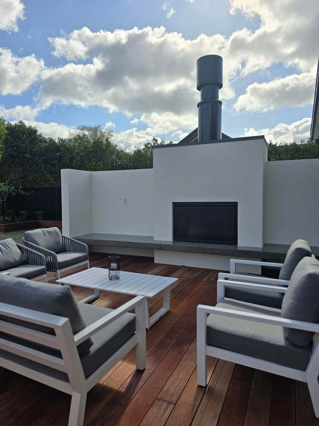 Modern outdoor patio with Onflame 1200 fireplace and 1.5m flue system.