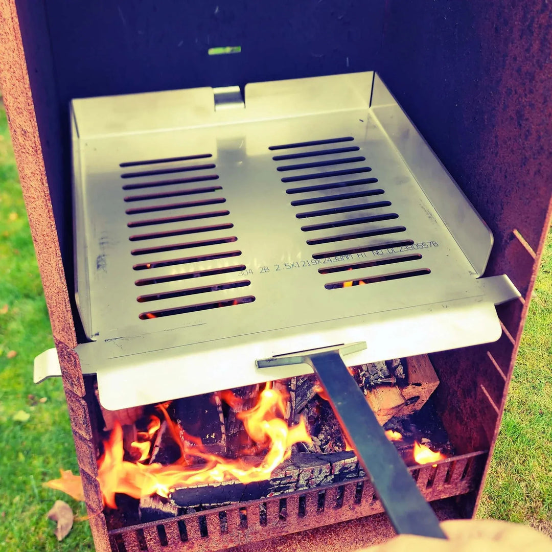 Pizza kit for Obelisk outdoor fire with stainless steel rack, pizza stone, and peel.