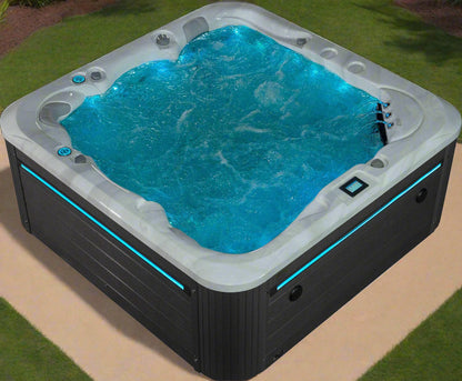 Sensation Tranquility 5-person spa pool with LED lights and ergonomic design for relaxation.