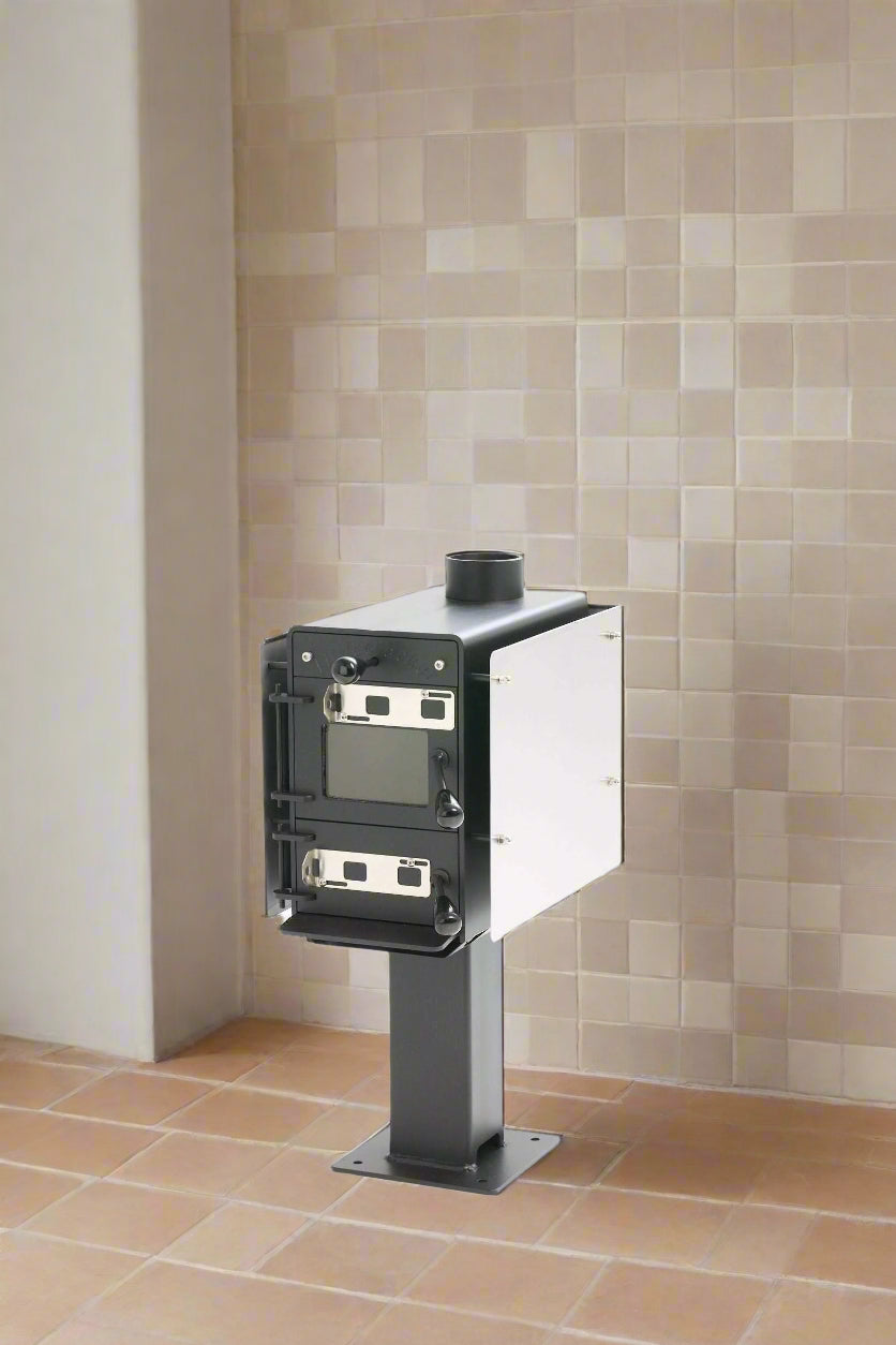 Little Cracker compact multi-fuel heater on pedestal for camper installations.