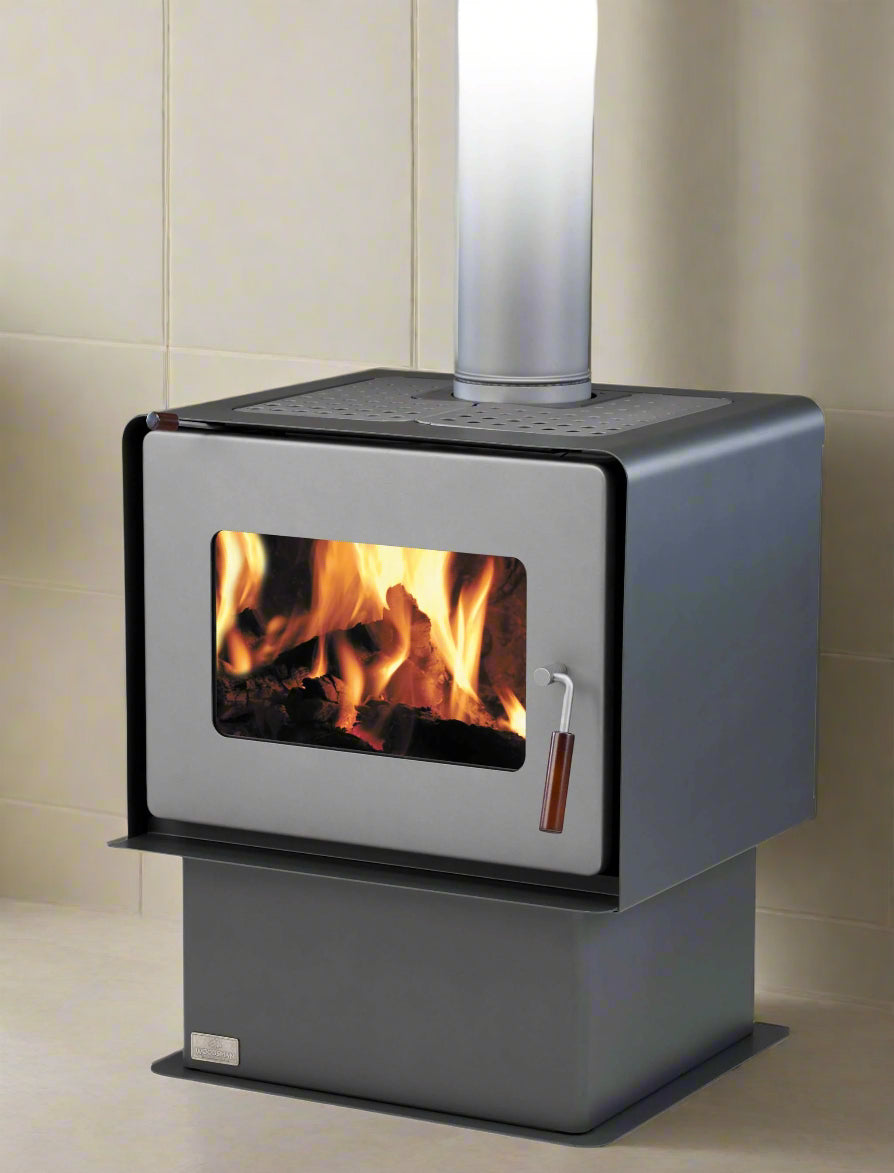 Woodsman Flare Pedestal Fire in charcoal with 4.2m heatsaver flue system.