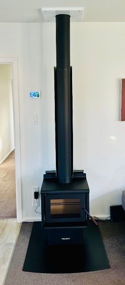woodsman kanaku installed on black hearth by yourstore nz