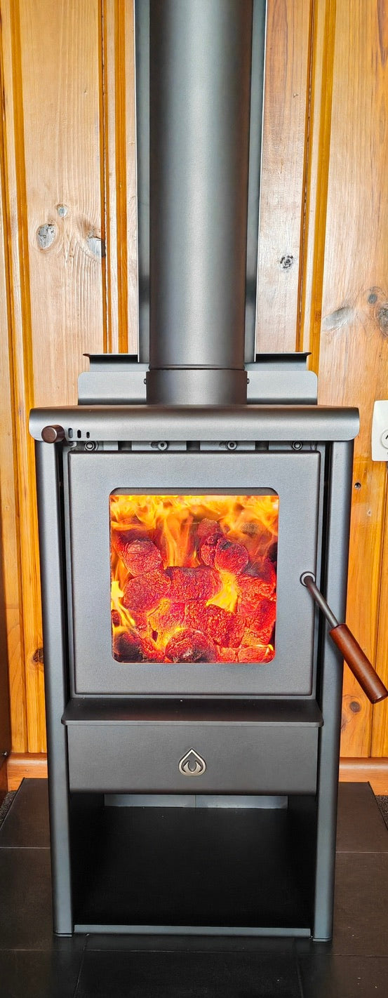 Woodsman fireplace - serene petite fire burning in lounge in christchurch